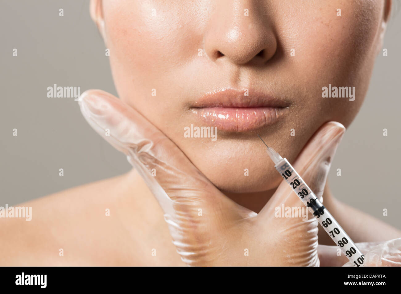 Chinese woman receiving a botox injection. Beauty Treatment. Stock Photo