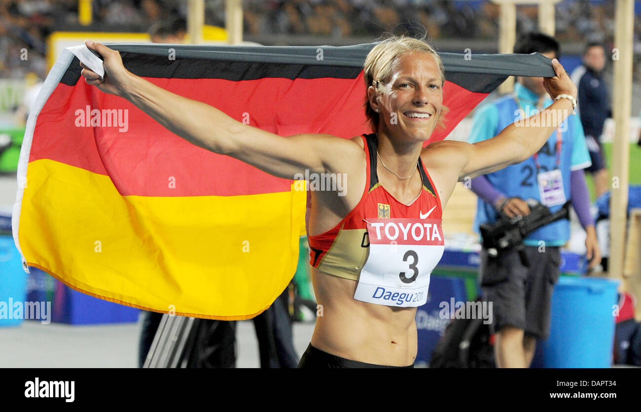 Jennifer Oeser of Germany celebrates after winning the bronce medal in Heptathlon at the 13th IAAF World Championships in Athletics, in Daegu, Republic of Korea, 30 August 2011. Photo: Rainer Jensen dpa  +++(c) dpa - Bildfunk+++ Stock Photo