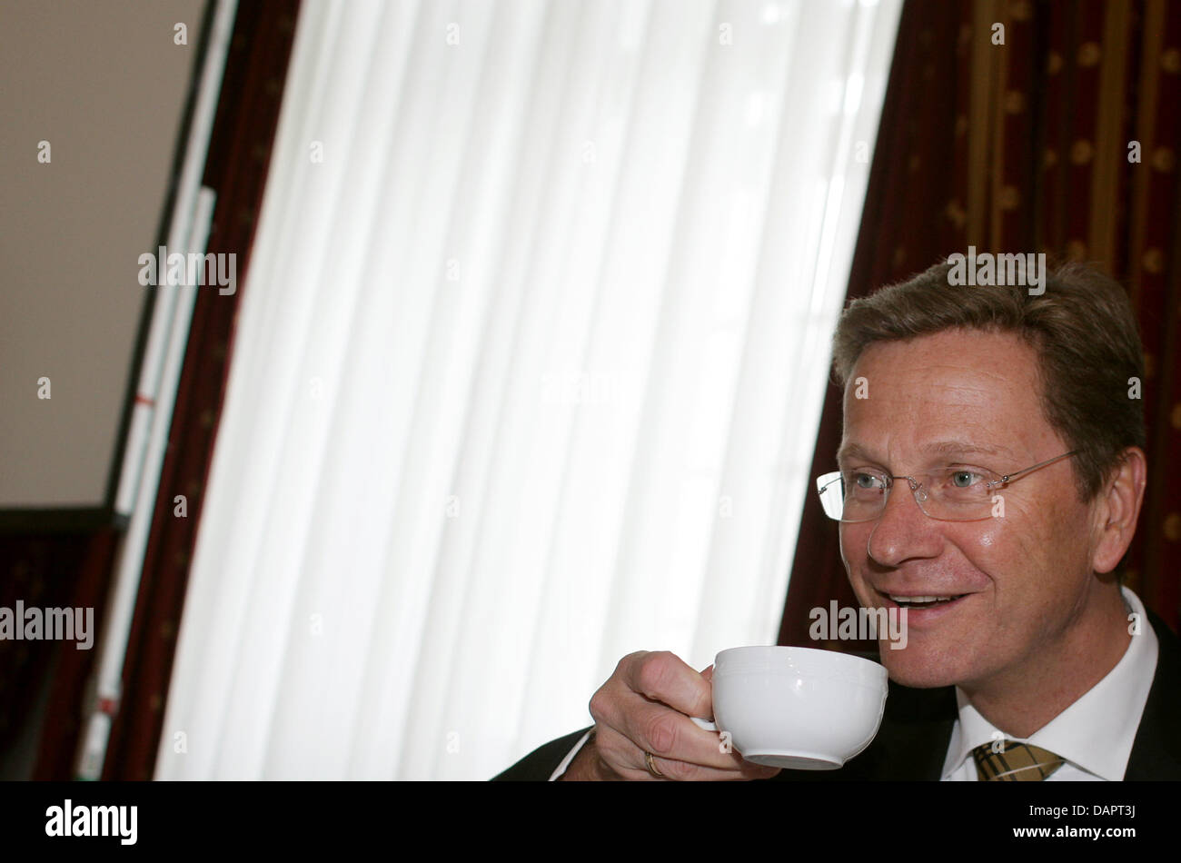 German Foreign Minister Guido Westerwelle attends the FDP's closed meeting at the Grandhotel Schloss Bensberg in Bergisch-Gladbach, Germany, 30 August 2011. The contested minister did not comment on inner-party demands to resign. Photo: Rolf Vennenbernd Stock Photo