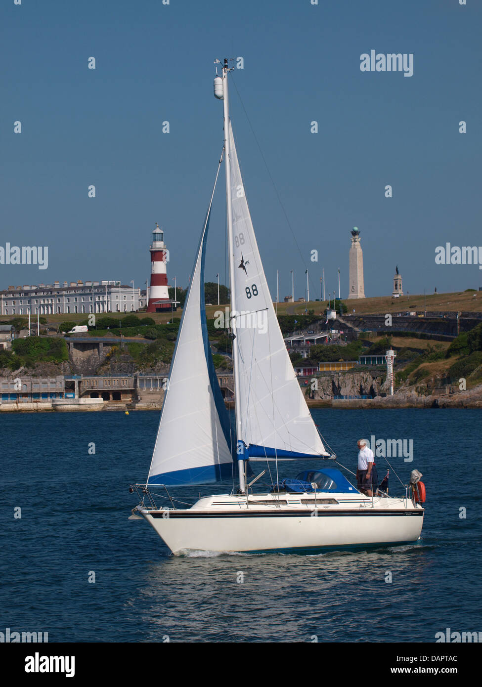 Yacht on the Plym Estuary going past Plymouth Hoe and the Smeaton's Tower, UK 2013 Stock Photo