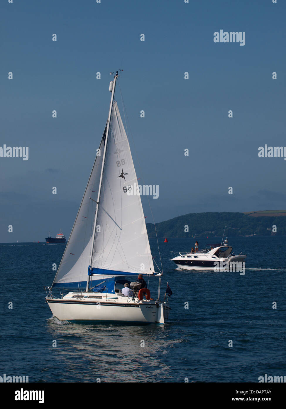 Yacht and Motorboat heading out to sea, Plymouth, UK 2013 Stock Photo