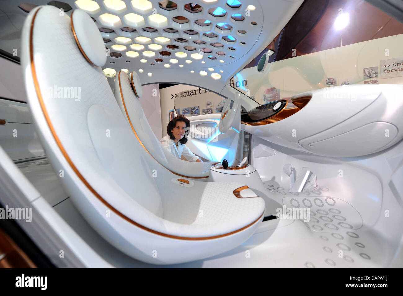 Head of car manufacturer Smart Annette Winkler poses next to a concept car Smart forvision in Sindelfingen, Germany, 30 August 2011. The concept car, which was built by car manufacturer Daimler and  the chemical corporation BASF, stands out for new technologies for more energy efficiency, lightweight construction, temperature management and design. Photo: MARIJAN MURAT Stock Photo