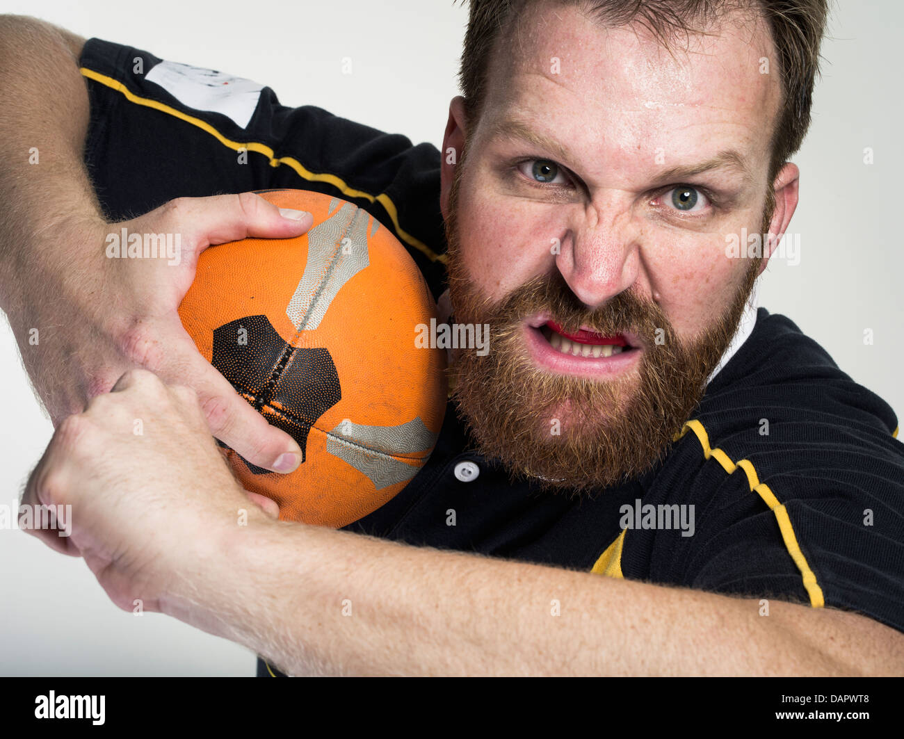 Rugby player with ball Stock Photo