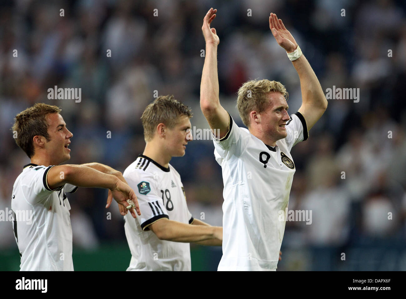 Germany's Mario Götze (l-r), Toni Kroos and Andre Schürrle celebrate after winning their EURO 2012 group A qualifier match Germany vs Austria at Arena Auf Schalke in Gelsenkirchen, Germany, 02 September 2011. Photo: Friso Gentsch dpa/lnw  +++(c) dpa - Bildfunk+++ Stock Photo