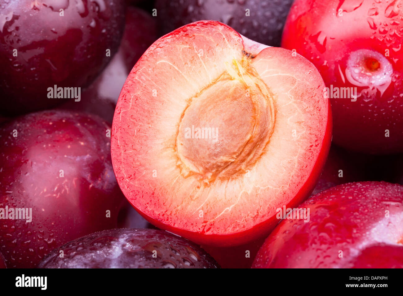 plum cut half macro closeup Stock Photo Alamy