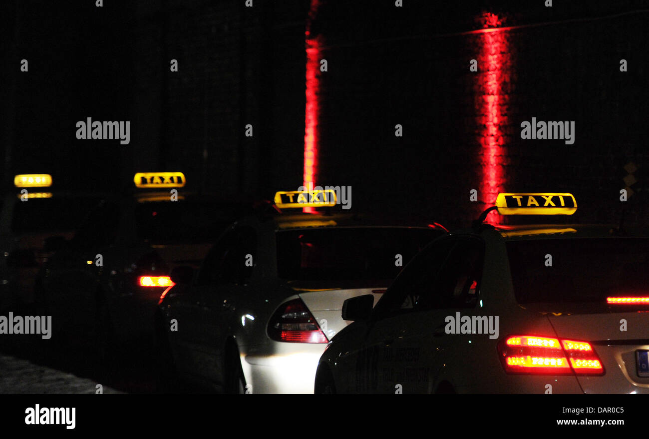 Taxis sit outside the entrance to Spindler & Klatt club is seen during the event 'Ibiza to Berlin' at the in Berlin, Germany, 06 September 2011. The label Beats by Dr. Dre Headphone held a launch party for new headphones. Photo: Jens Kalaene Stock Photo