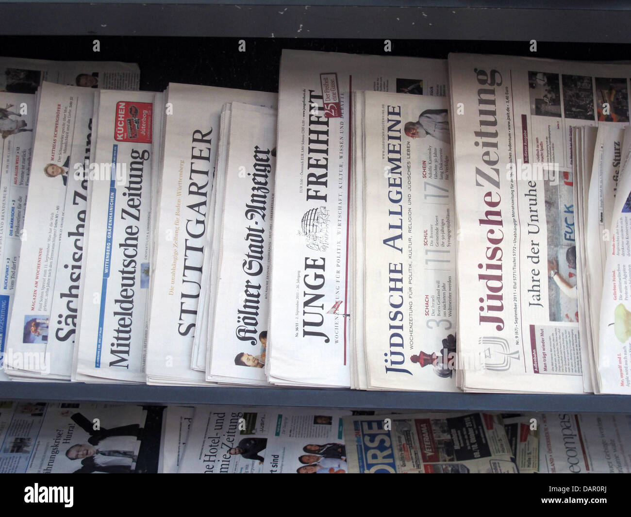 Different newspapers, among them the 'Junge Freiheit' and 'Juedische Allgemeine' lie at a newspaper shop in Berlin, Germany, 3 September 2011. Photo: Jens Kalaene Stock Photo