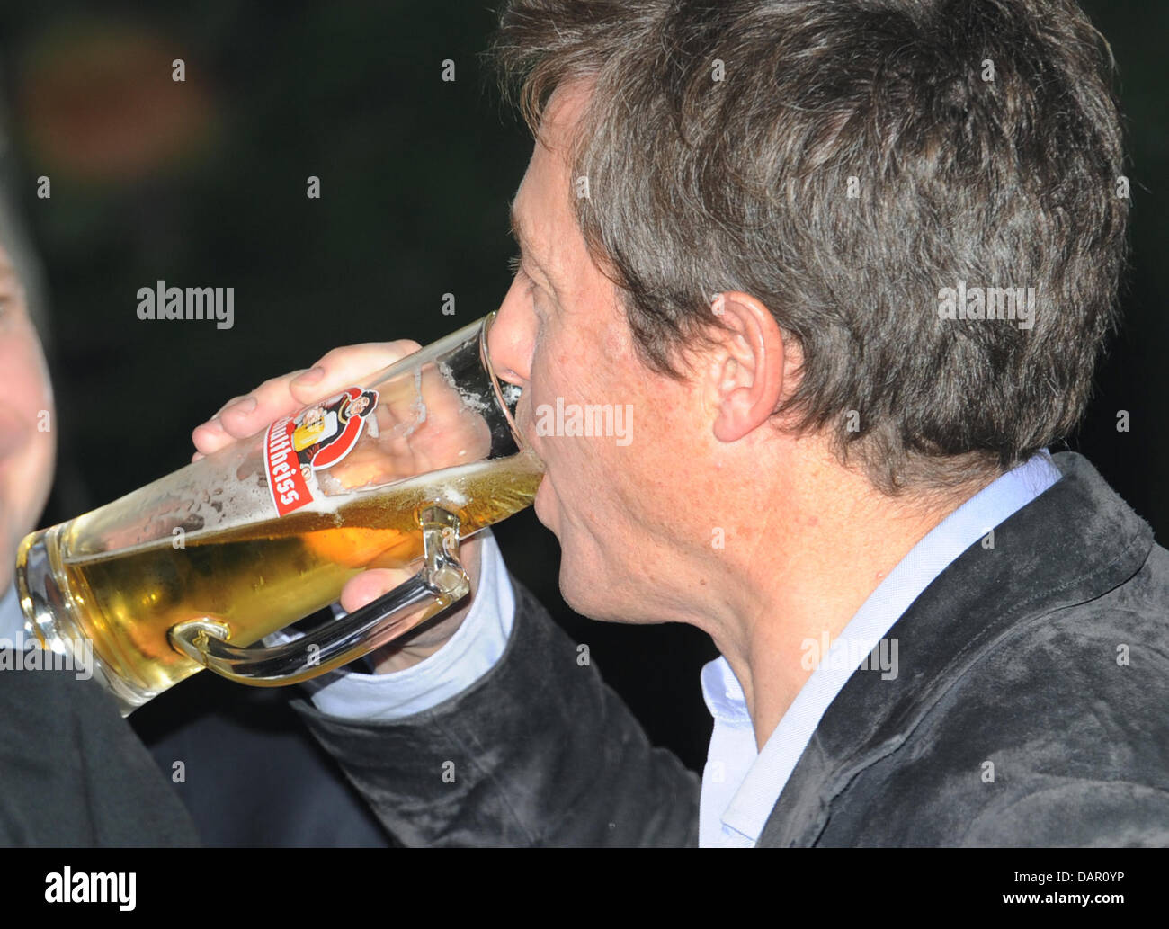 The British actor Hugh Grant has a beer at the premiere party of