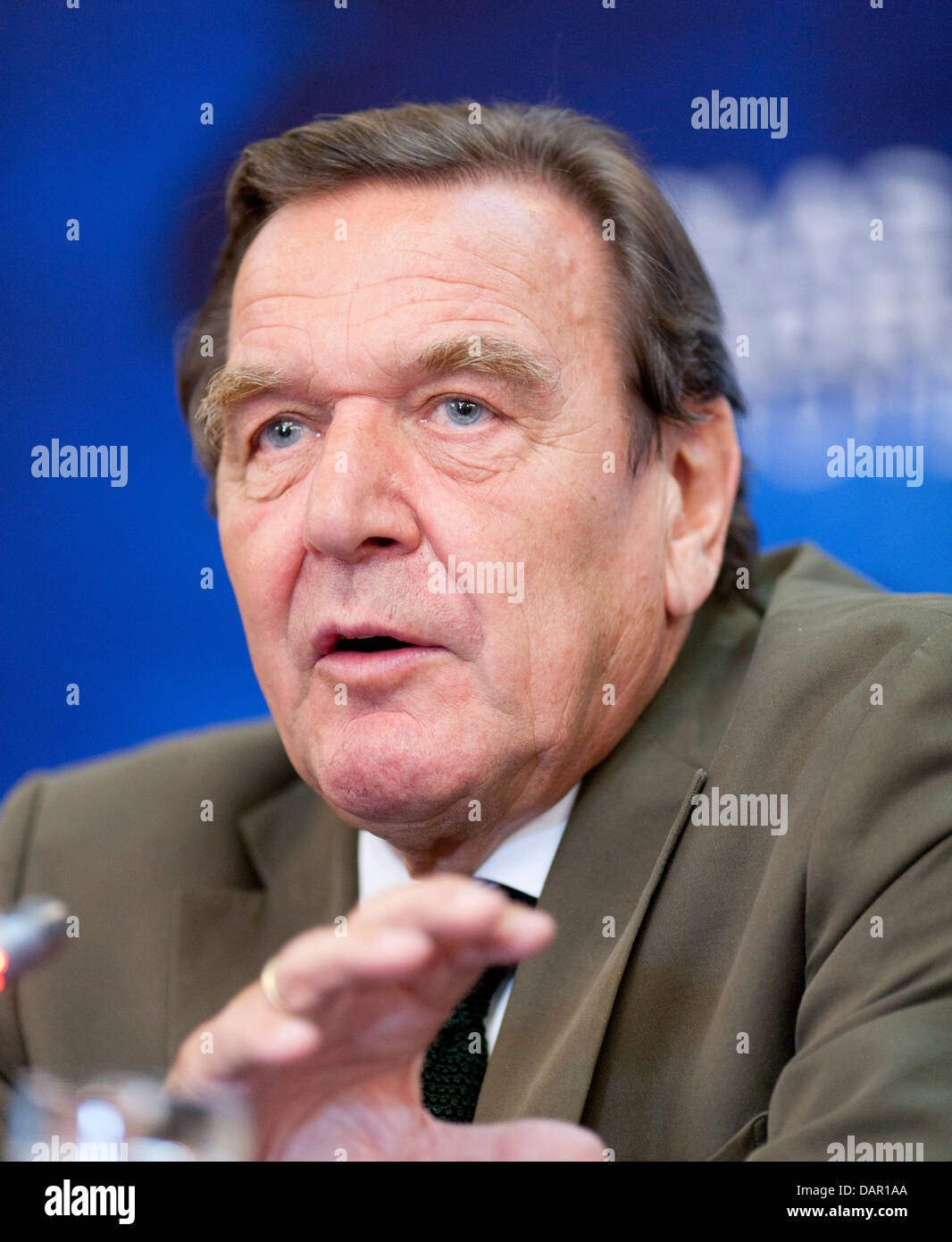 Former german Chancellor Gerhard Schröder talks to media during a press ...