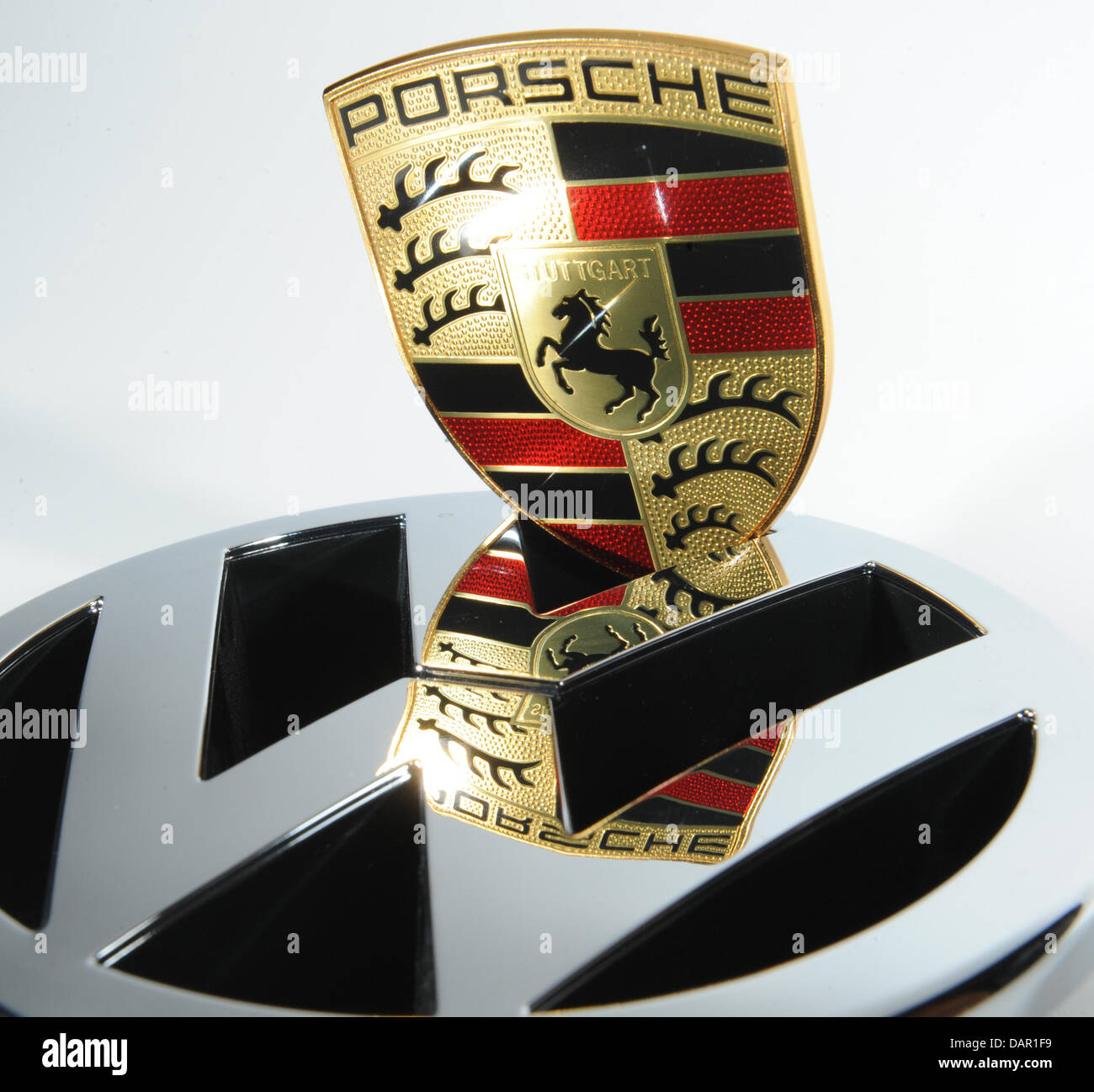 ILLUSTRATION - The illustration shows the logos of German car manufacturers  Volkswagen (VW) and Porsche in Freiburg, Germany, 09 September 2011. The  two companies have announced that they will not be completing