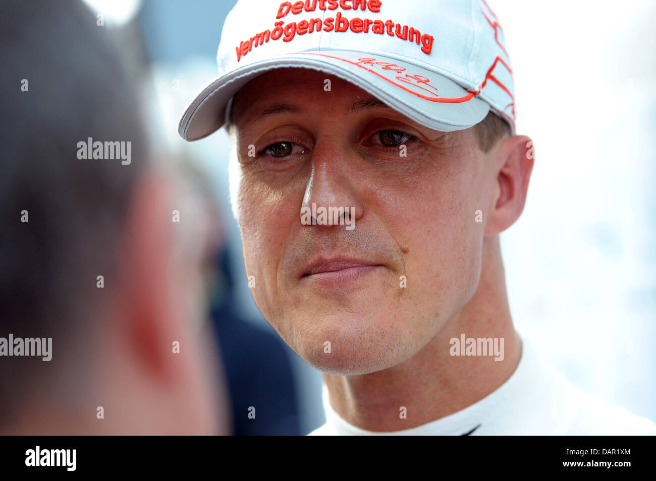 German Formula One driver Michael Schumacher of Mercedes GP talks to