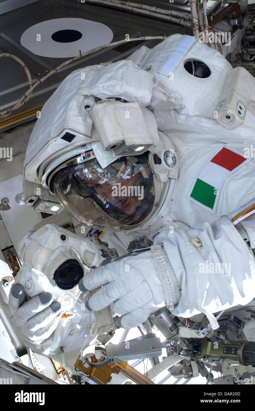 European Space Agency astronaut Luca Parmitano during a space walk outside the International Space Station July 16, 2013. A little more than one hour into the spacewalk, Parmitano reported water floating behind his head inside his helmet. The water was not an immediate health hazard for Parmitano but Mission Control decided to end the spacewalk early. Stock Photo