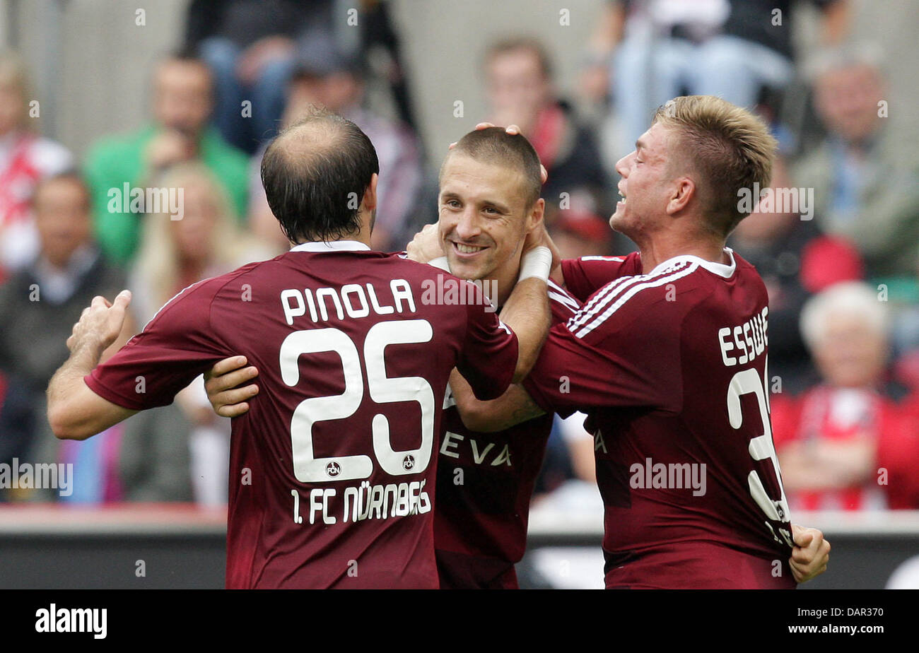 Nuremberg's Timmy Simons (C) celebrates his 1-0 penalty goal with Javier Pinola (L) during the German Bundesliga match between 1st FC Cologne and 1st FC Nuremberg at RheinEnergieStadium in Cologne, Germany, 11 September 2011. Photo: ROLF VENNENBERND   (ATTENTION: EMBARGO CONDITIONS! The DFL permits the further utilisation of the pictures in IPTV, mobile services and other new techn Stock Photo