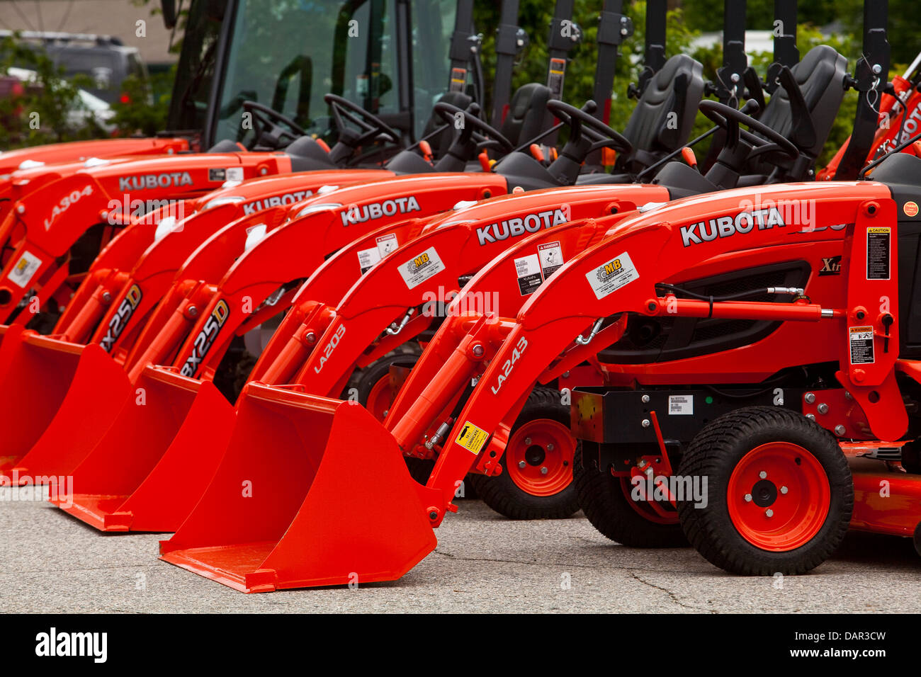 Kubota loaders are lined up at a dealership in Conway, New Hampshire
