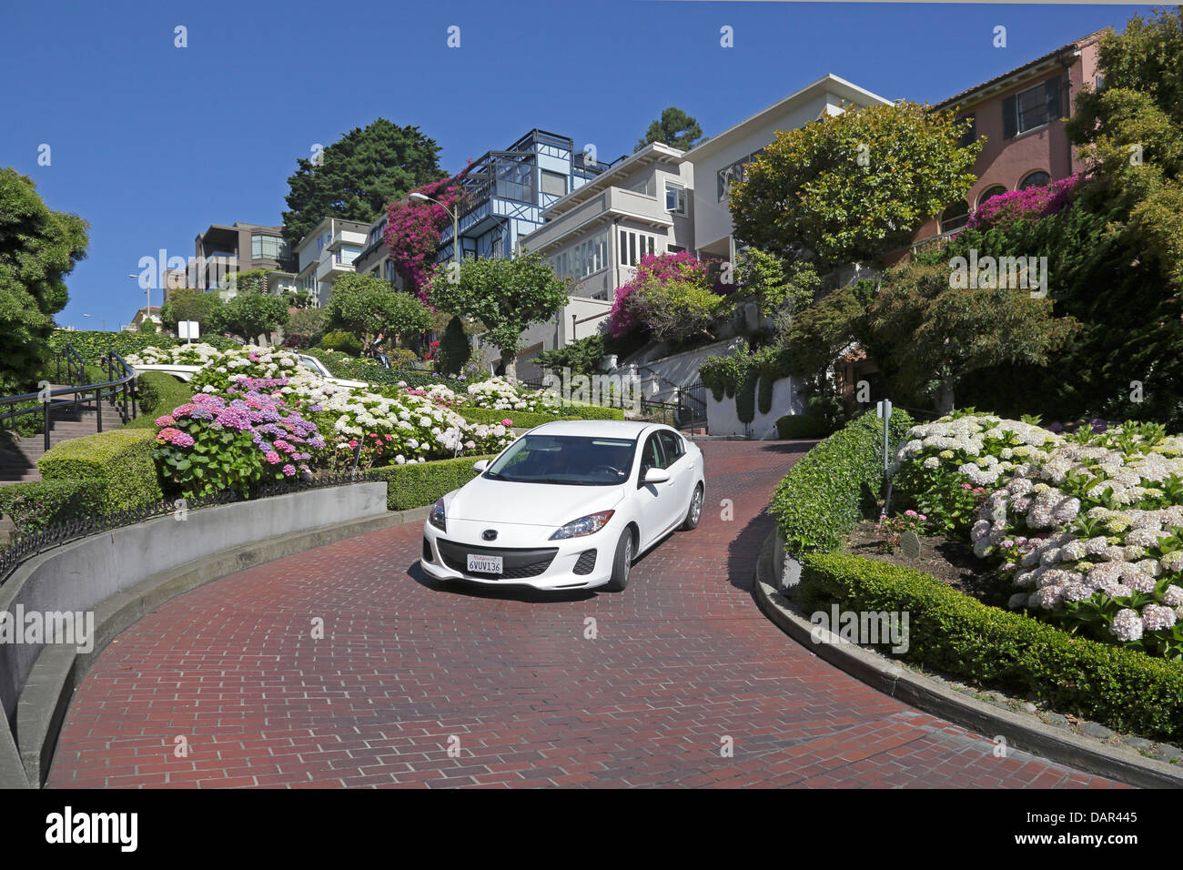Car descending Lombard Street San Francisco California Stock Photo