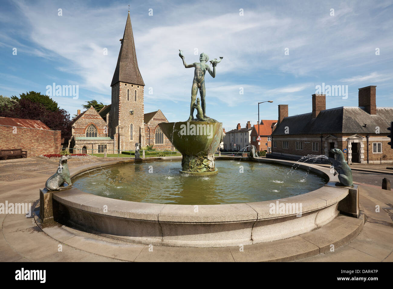Great Britain England Essex Braintree St Michaels Church with Bronze Statue of Young Boy holding Dolphins with Sea lions around Stock Photo
