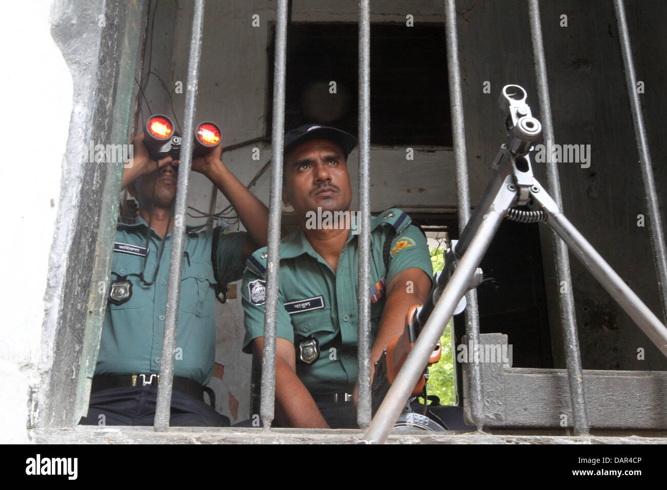 Dhaka, Bangladesh. 17th July, 2013. Bangladeshi police keep watch from