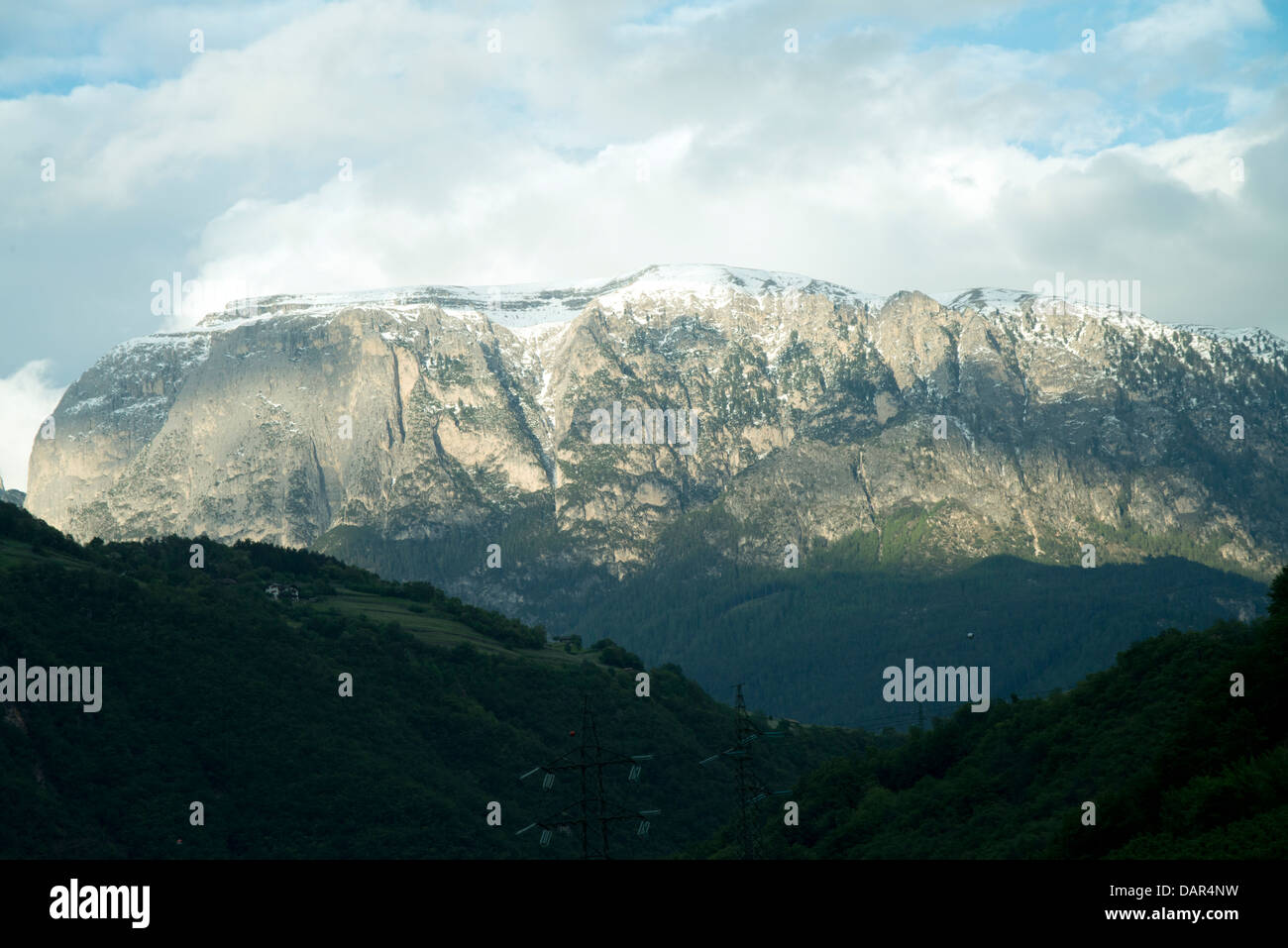 Snowy Dolomite mountain peak with dramatic clouds in Italy Stock Photo ...