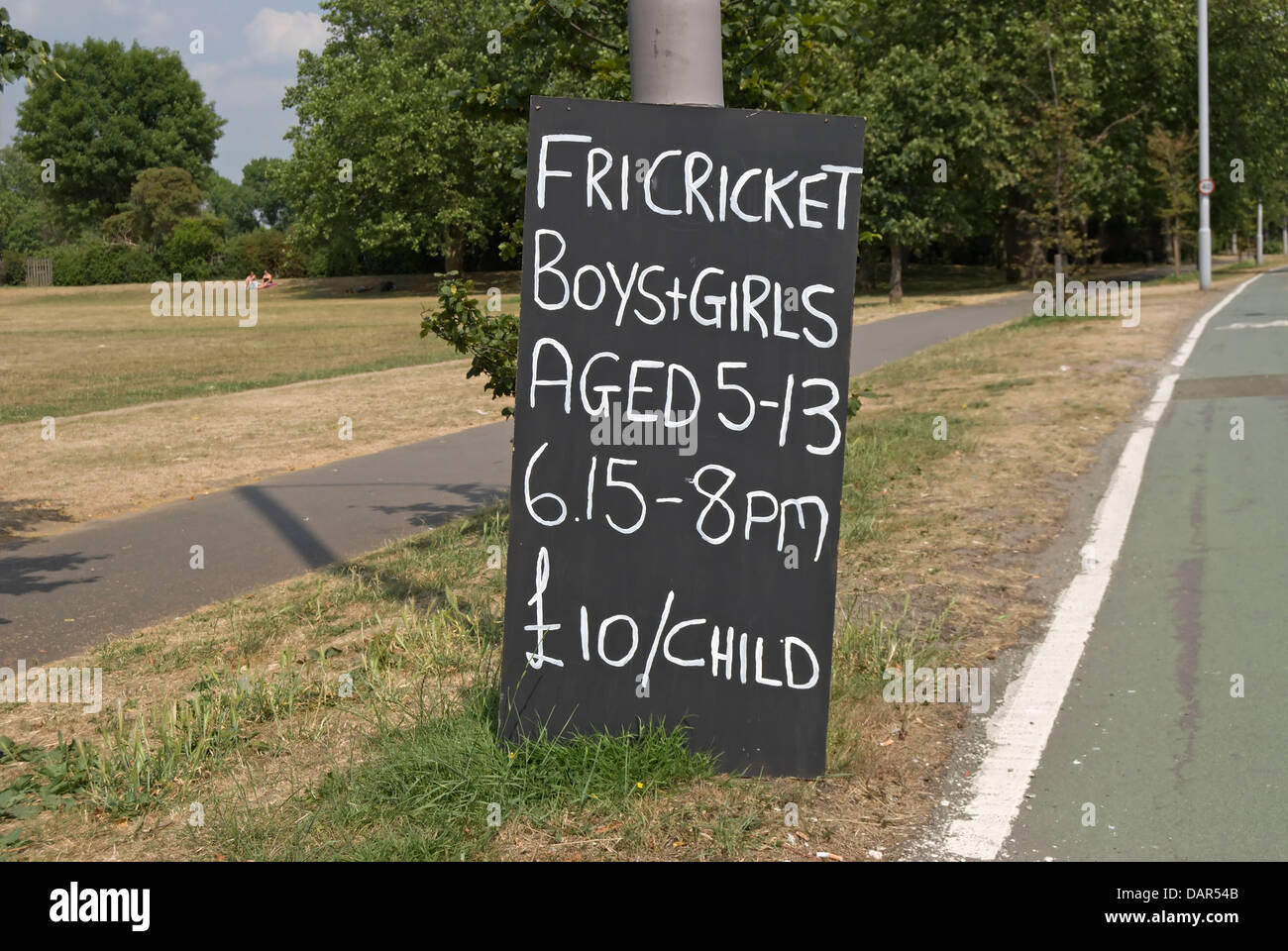 handmade road side sign advertising friday cricket for young boys and girls, richmond, surrey, england Stock Photo
