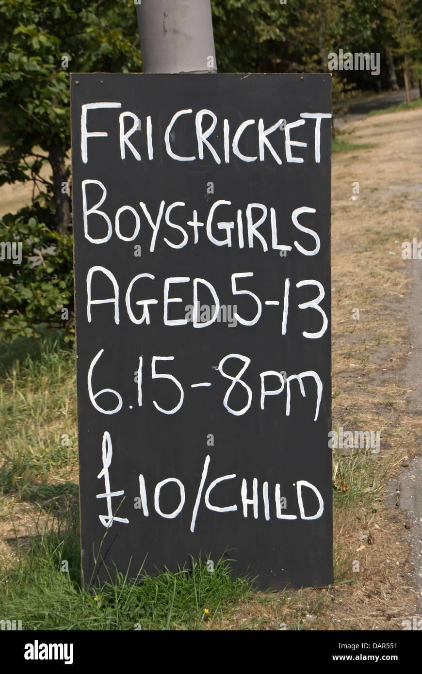 handmade road side sign advertising friday cricket for young boys and girls, richmond, surrey, england Stock Photo