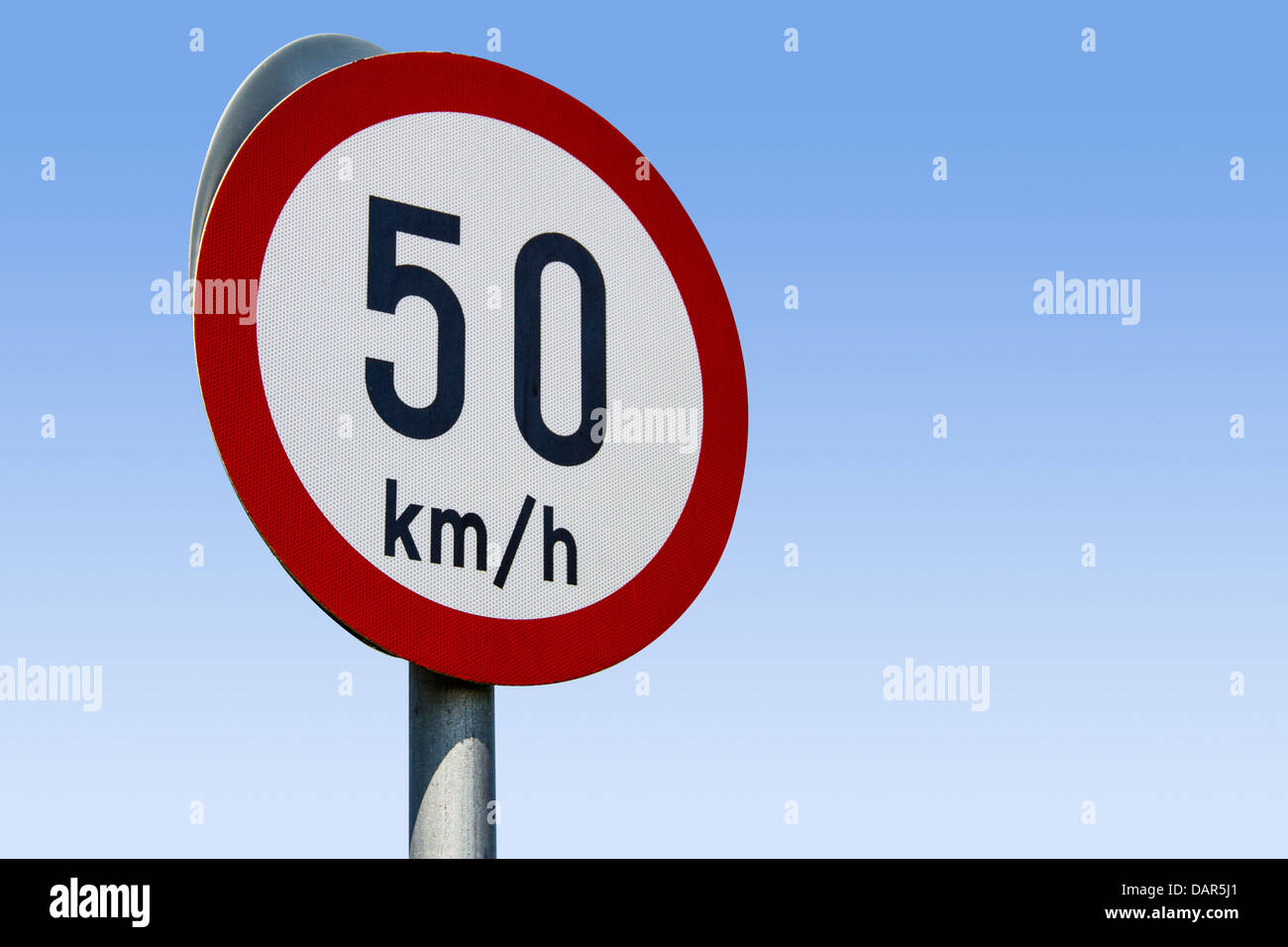 50km speed limit road sign on blue sky - watch your speed. European Road sign. Stock Photo