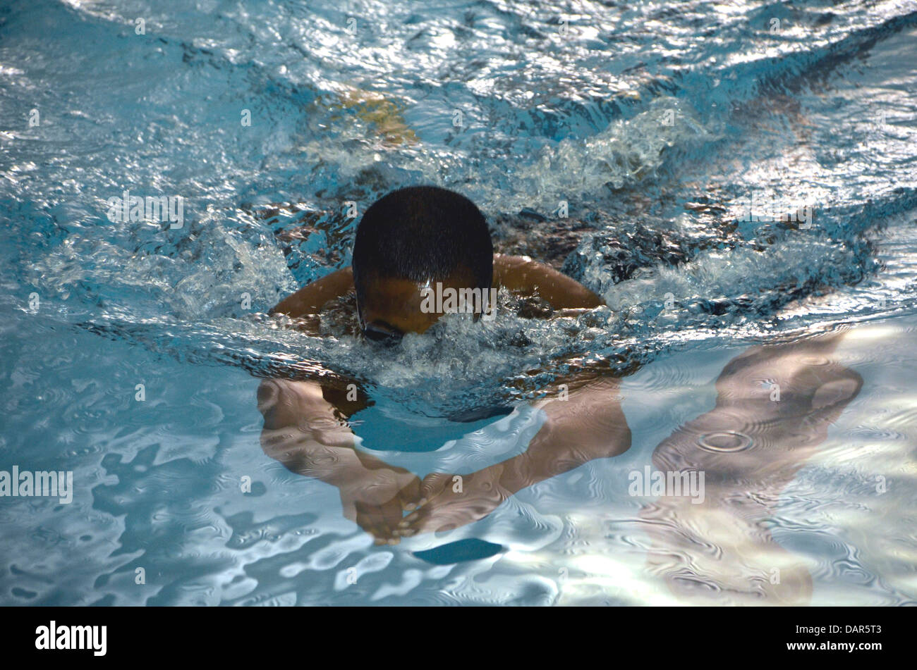Swimmer swimming in a swim meet Stock Photo