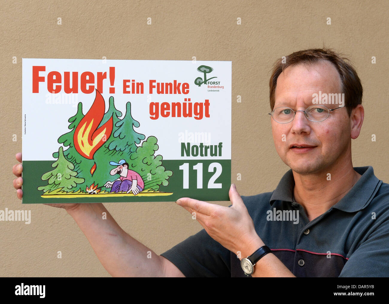 Forest fire protection official of Brandenburg, Raimund Engel, shows a