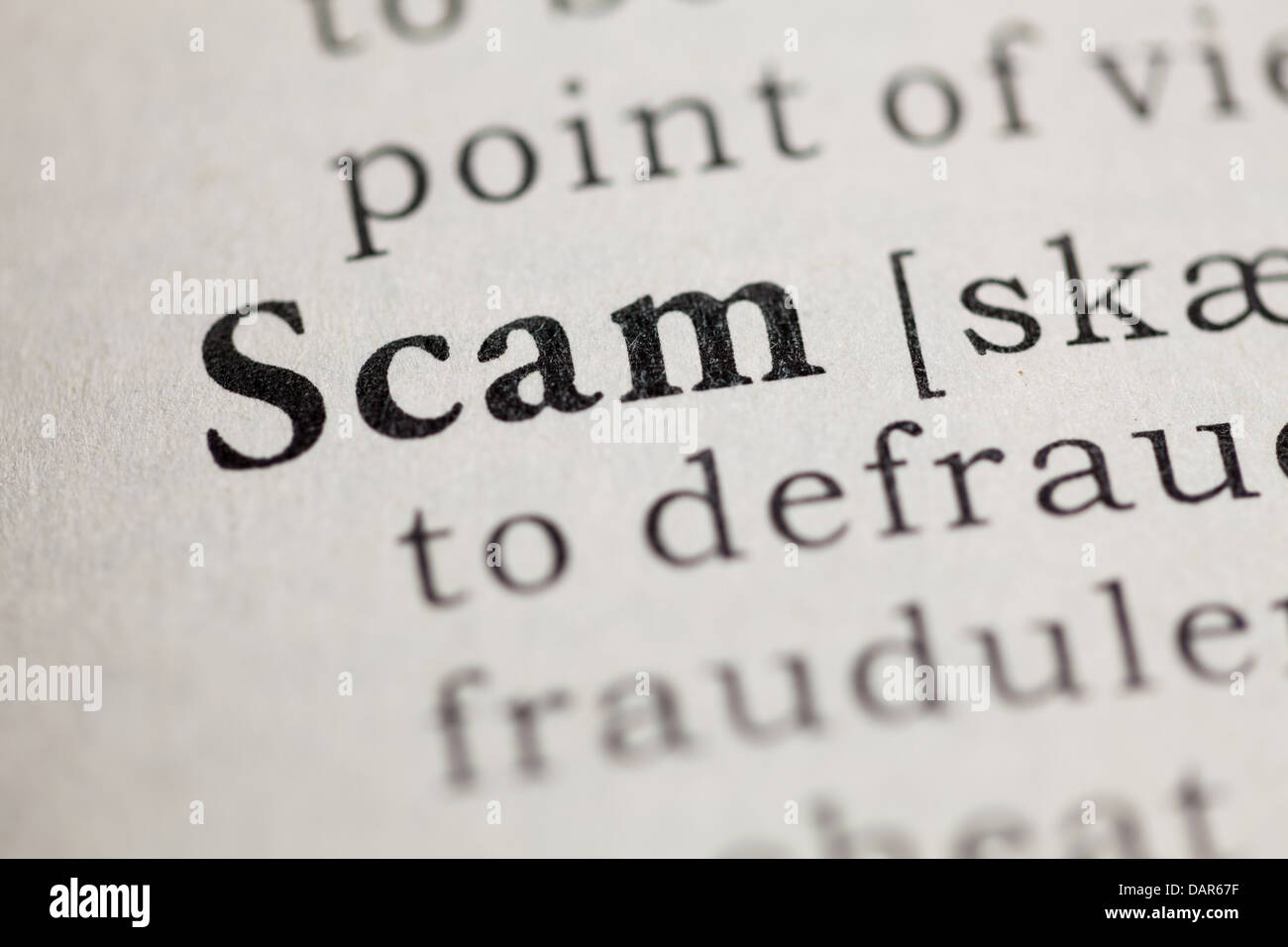 Fake Dictionary, Dictionary definition of the word Scam. Stock Photo