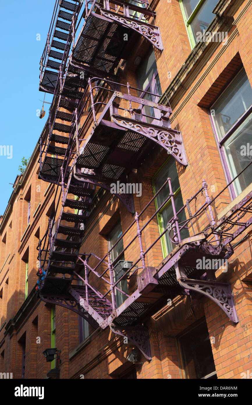 England, Manchester, old fire escapes on mill building Stock Photo