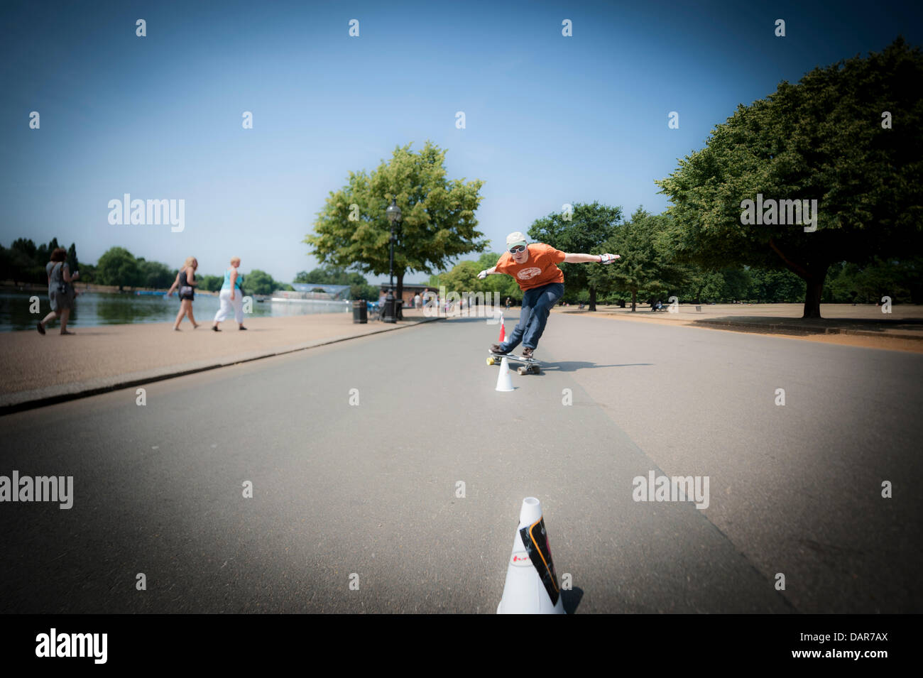 London, UK. 17th July 2013. A skateboarder in Hyde Park, London. As the heatwave weather continues in the UK, Londoners and tourists alike find ways to cool off. Credit:  Lee Thomas/Alamy Live News Stock Photo