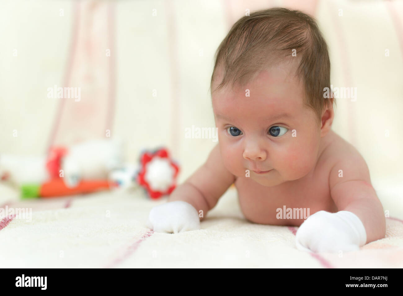 Infant baby (1 month old) lying on tummy. Shallow depth of field Stock Photo