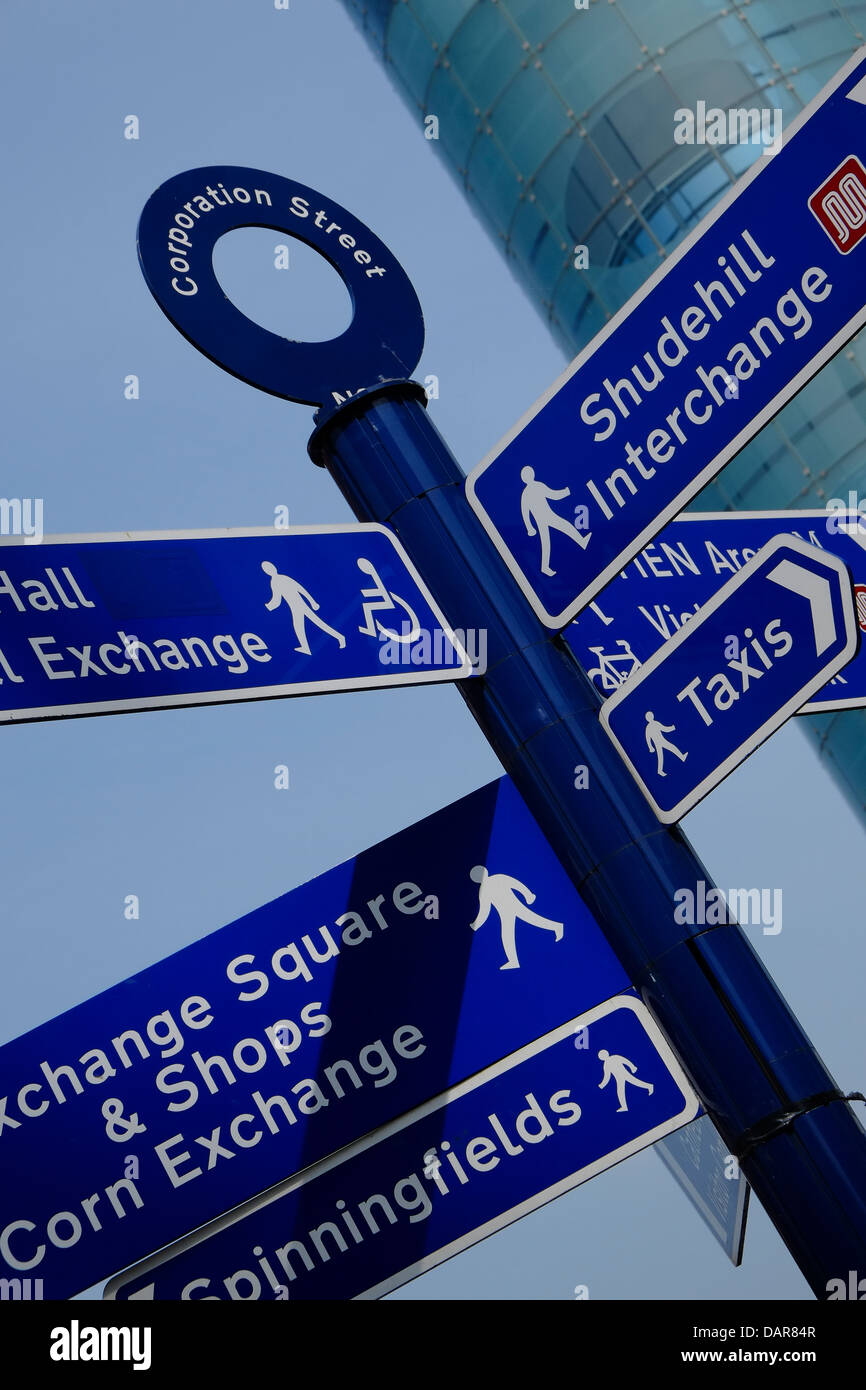 England, Manchester, Urbis building and street direction signs Stock Photo