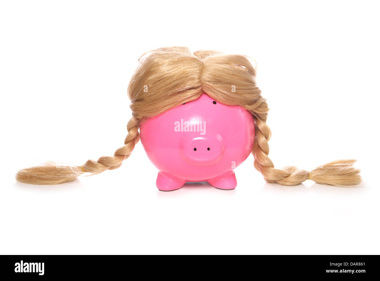 piggy bank wearing a wig studio cutout Stock Photo