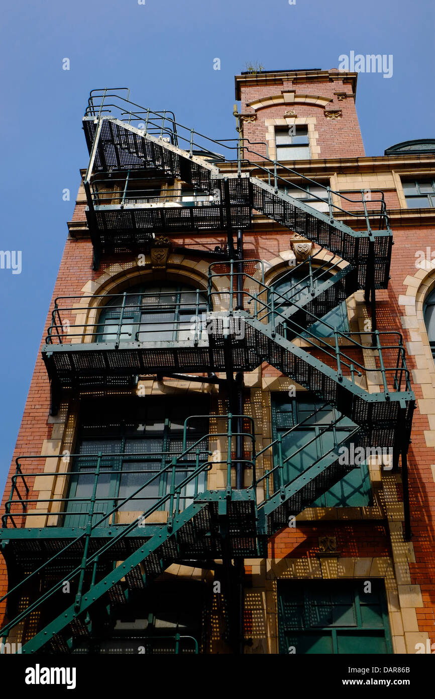 England, Manchester, cast iron fire escape on old mill building Stock Photo