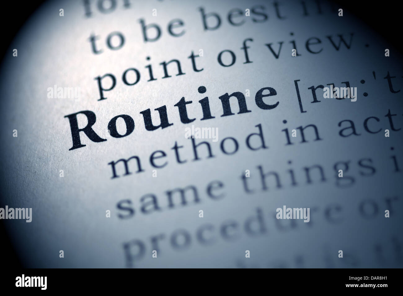 Fake Dictionary, Dictionary definition of the word Routine. Stock Photo