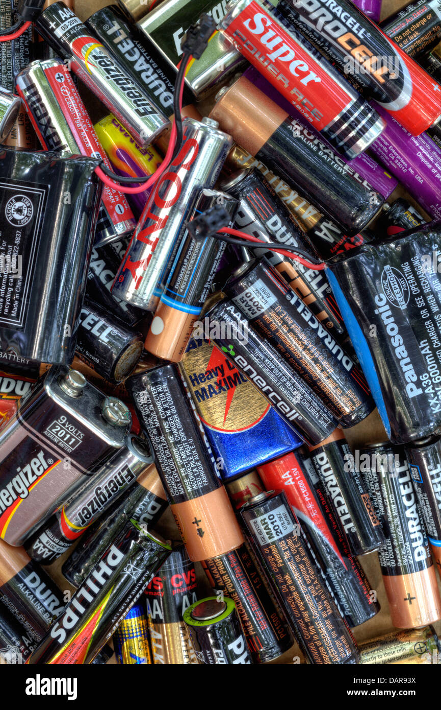 Different king of dead batteries lying in a heap for recycling Stock