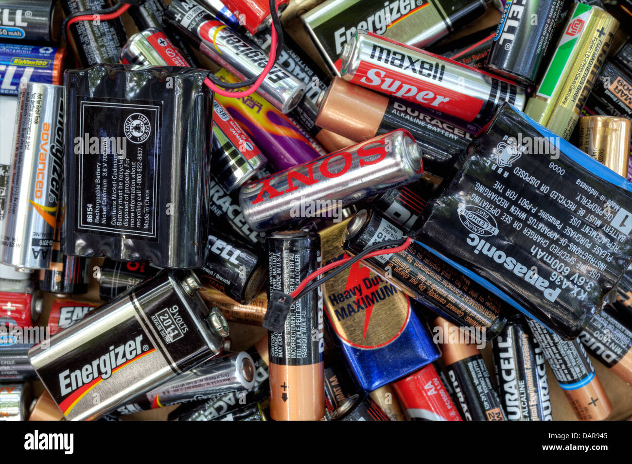 Different king of dead batteries lying in a heap for recycling Stock