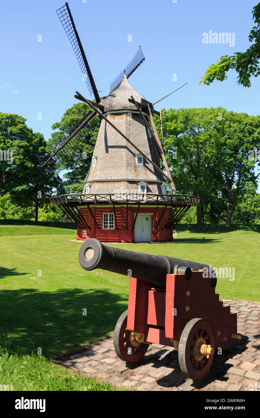 Cannon with windmill 1847 on King's Bastion in the Kastellet or Frederikshavn Citadel. Copenhagen, Zealand, Denmark Stock Photo