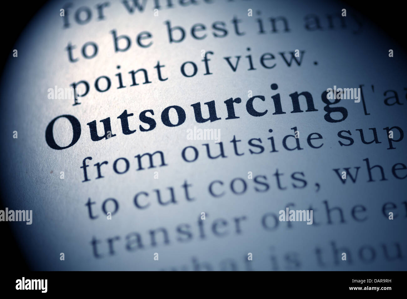 Fake Dictionary, Dictionary definition of the word Outsourcing. Stock Photo