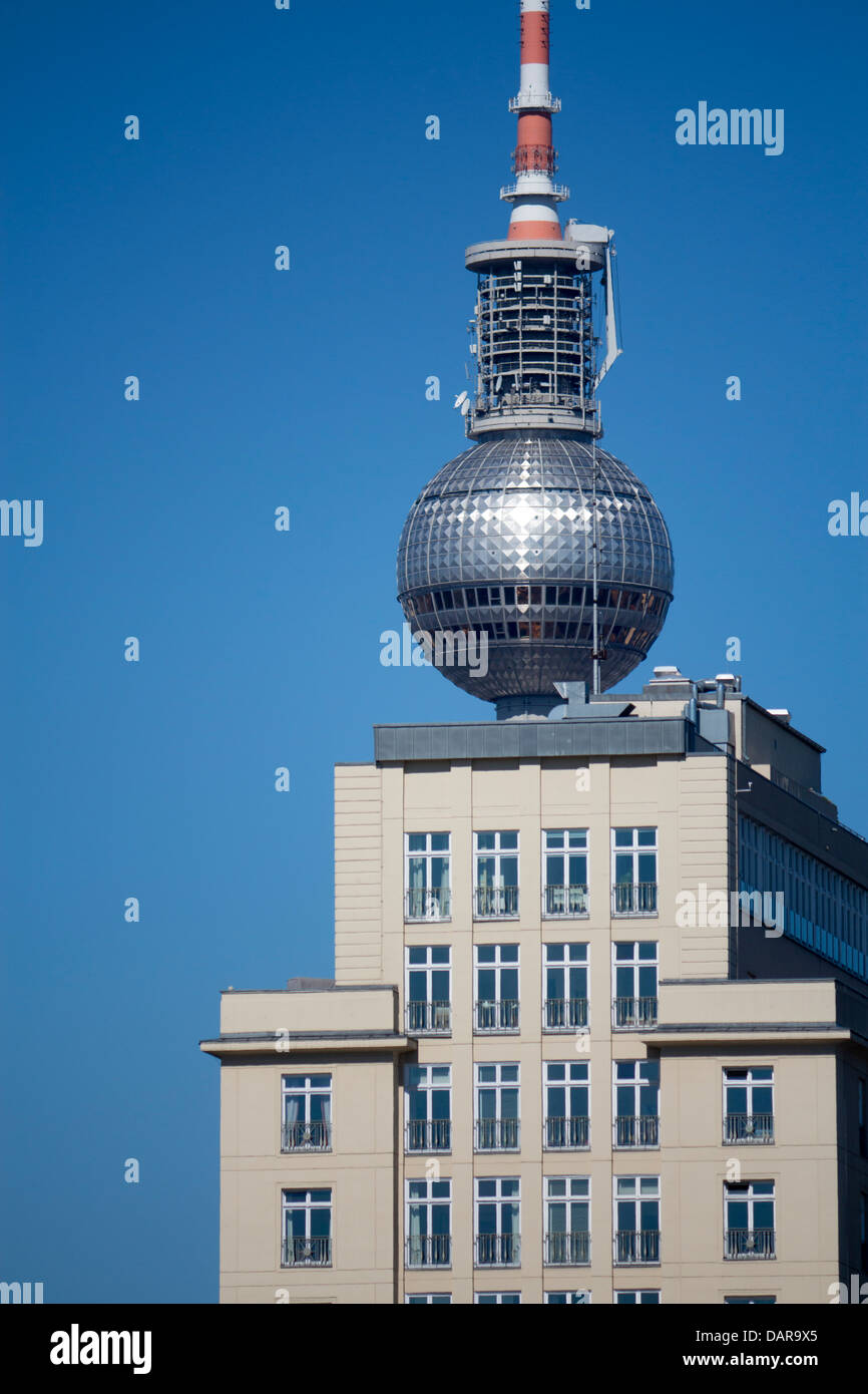 Fernsehturm TV Tower and part of Socialist Realist style building on Strausberger Platz Berlin Germany Stock Photo