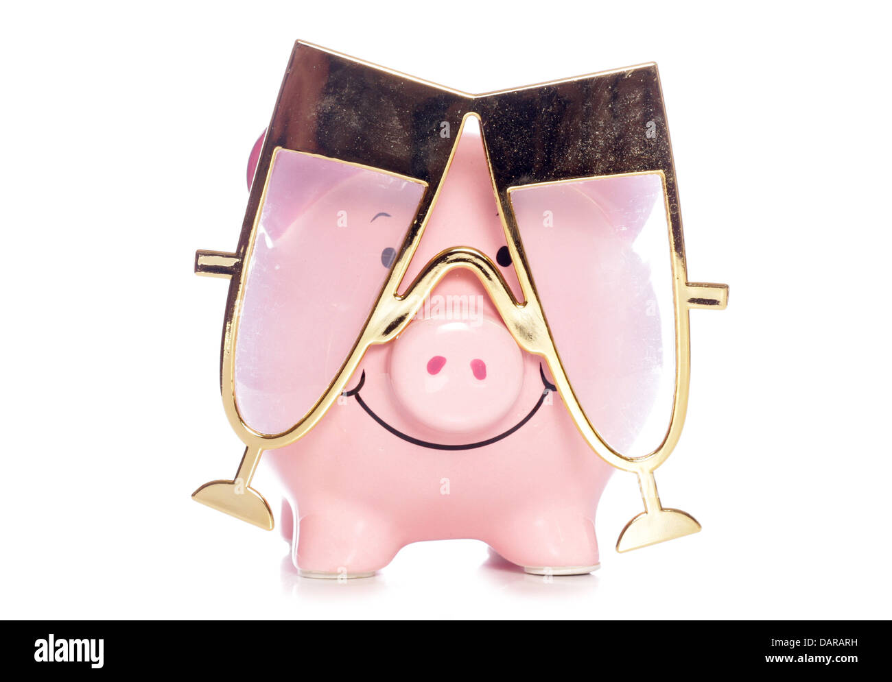 Piggy bank wearing Champagne party glasses studio cutout Stock Photo
