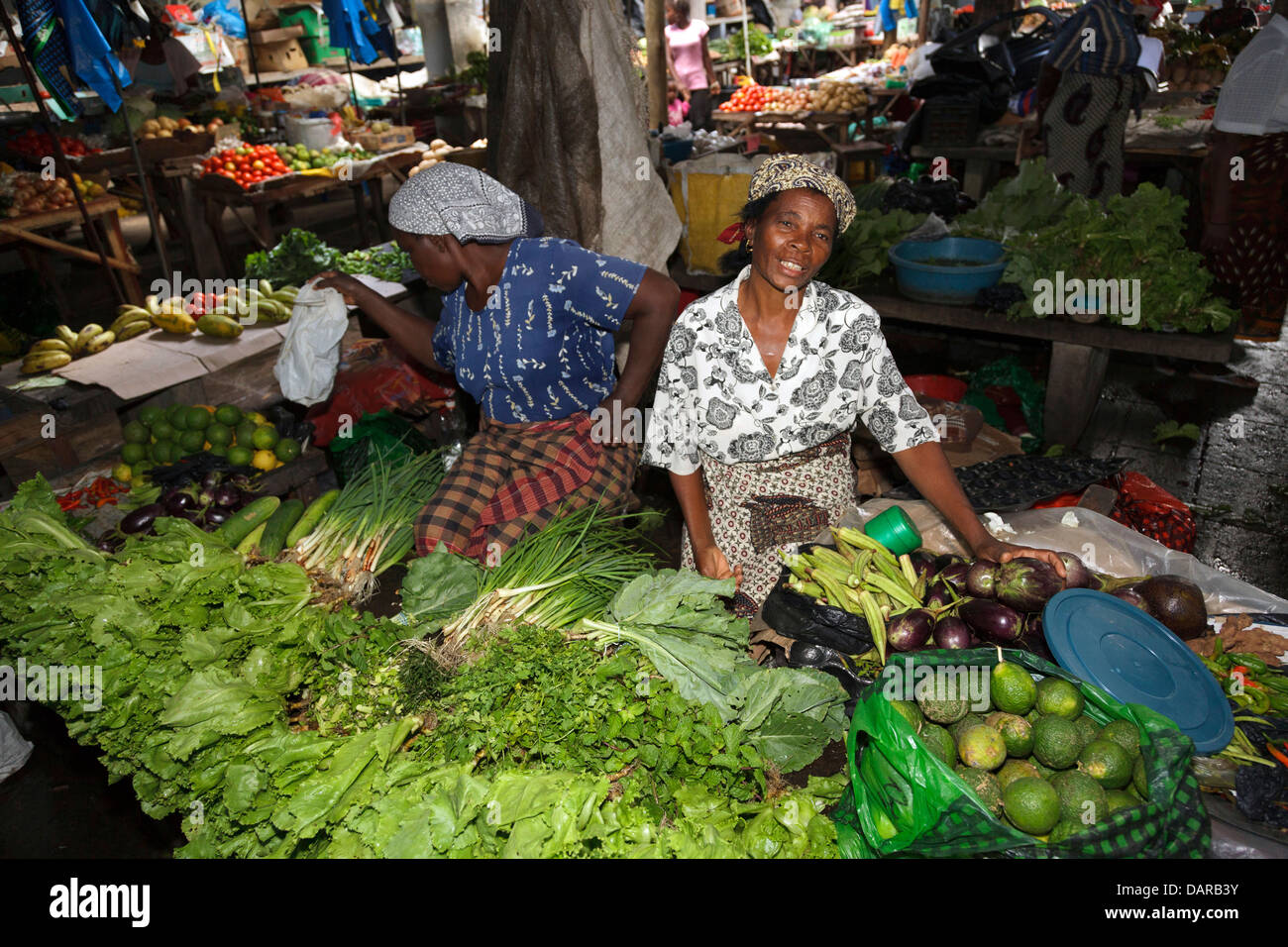 Africa, Mozambique, Inhambane. Women selling vegetables in Central Market. Stock Photo