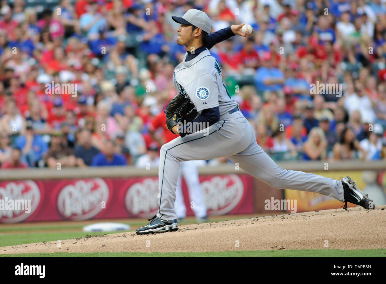 July 4, 2013 - Arlington, TX, USA - Seattle Mariners starting pitcher Hisashi Iwakuma (18) delivers a pitch during the first inning of an MLB baseball game between the Seattle Mariners and the Texas Rangers at Rangers Ballpark in Arlington in Arlington, TX, Thursday, July 4, 2013. Stock Photo
