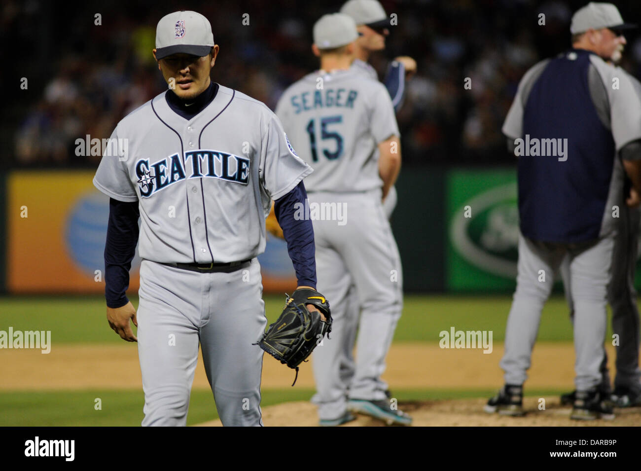 July 4, 2013 - Arlington, TX, USA - Seattle Mariners starting pitcher Hisashi Iwakuma (18) leaves the game in the seventh inning of a baseball game between the Seattle Mariners and the Texas Rangers at Rangers Ballpark in Arlington in Arlington, TX, Thursday, July 4, 2013. Stock Photo