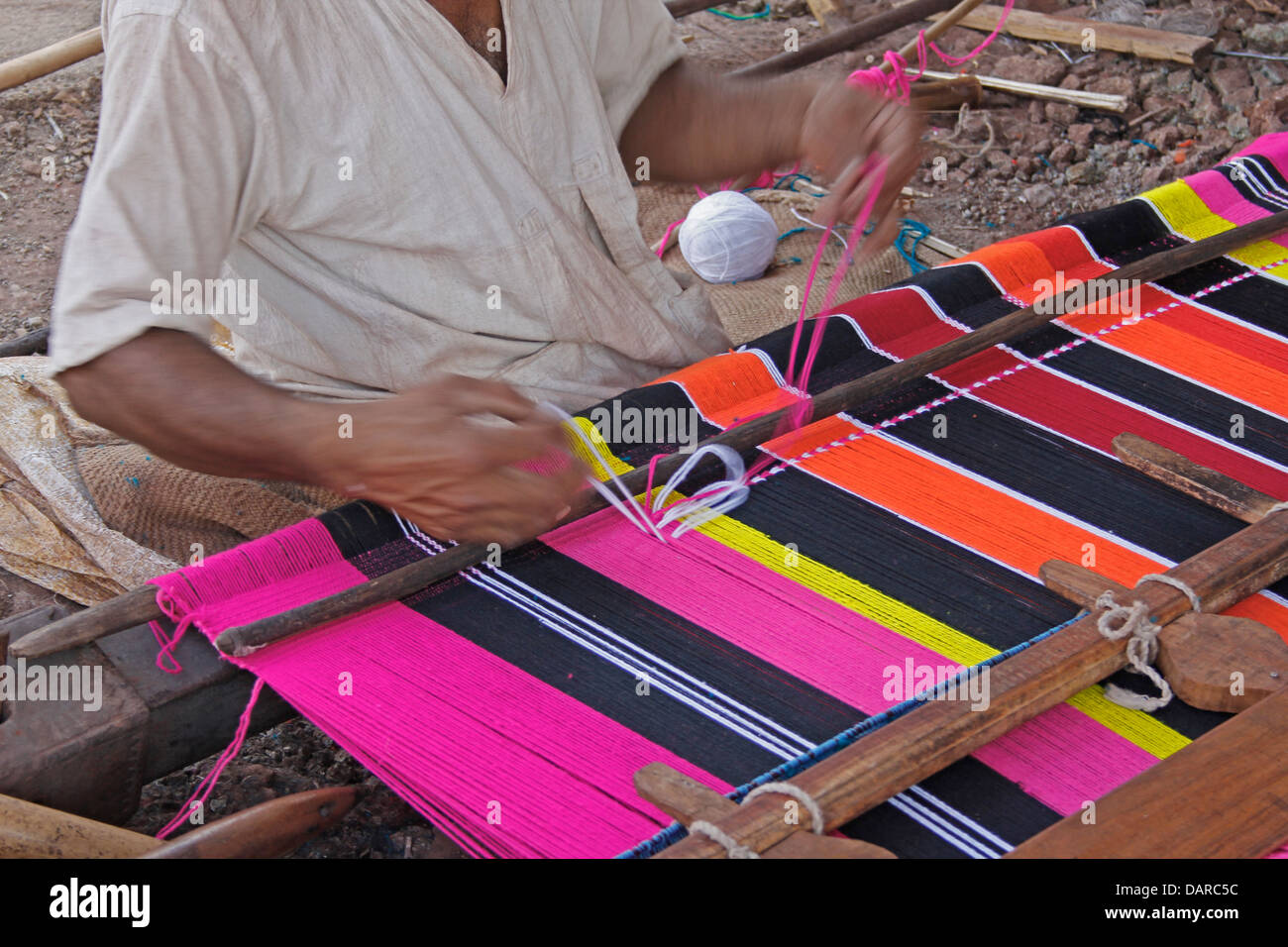 Man Making Ghongadi, desi blanket from sheep wool, Hand-made Multicolor Woolen Blanket, India Stock Photo