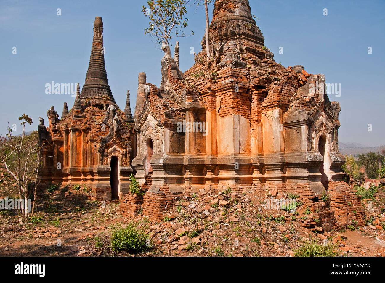 Ruins of ancient stupas, or Bagan + Shan style pagodas, near Indein village on Lake Inle in Shan state. Stock Photo