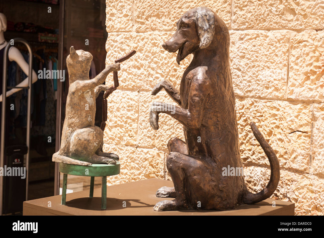 Israel Jerusalem Alrov Mamilla Avenue Mall modern contemporary art exhibition Humor & Satire statue sculpture by Dr Kizelshtain Martin cat feeding dog Stock Photo
