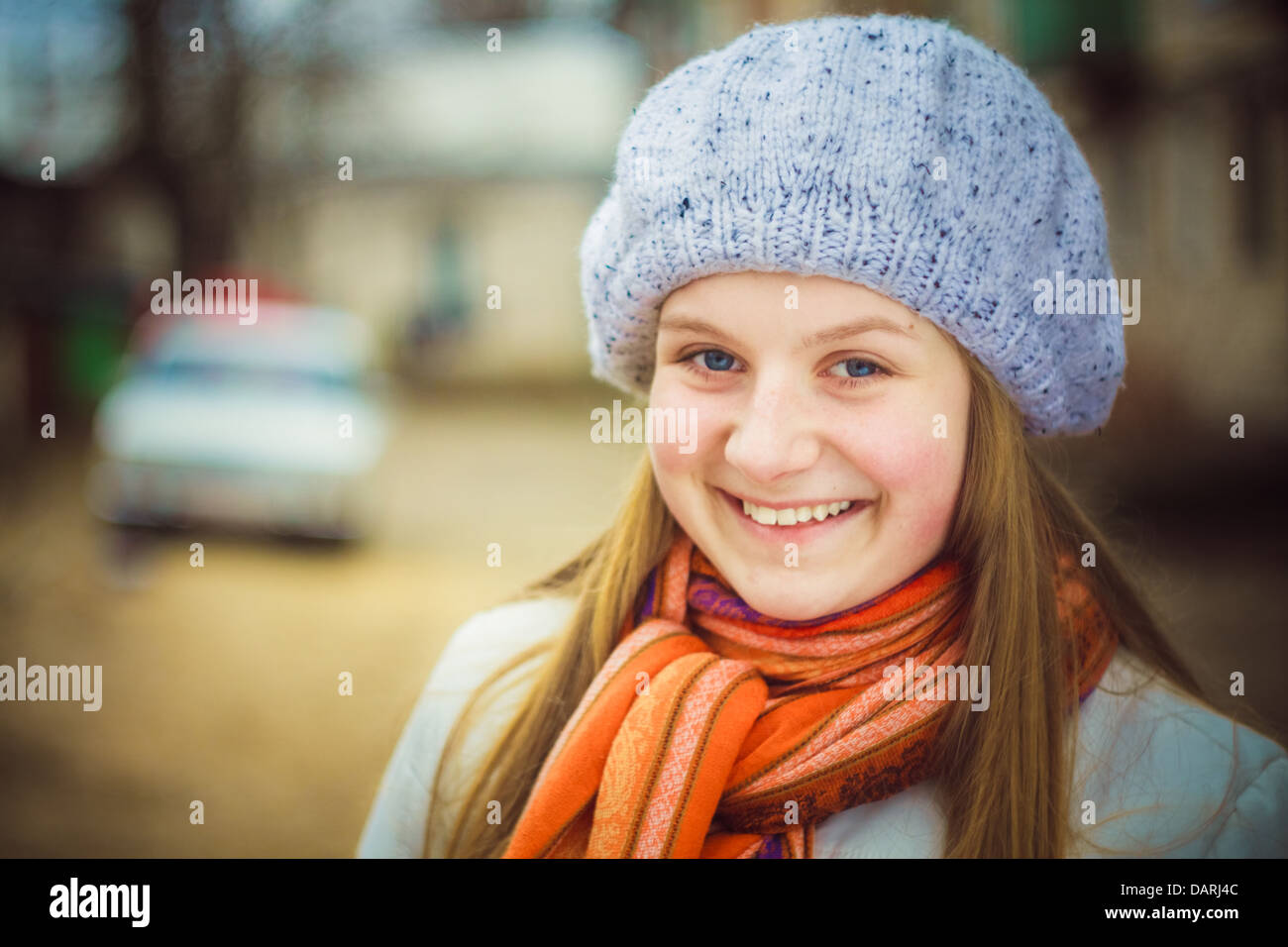 Teen Girl Wearing White Beret And Orange Scarf In Windy Day Stock Photo ...