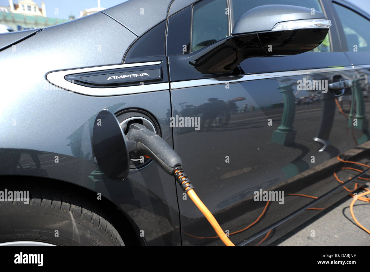 Electric car recharging at charging point Brighton seafront UK Stock