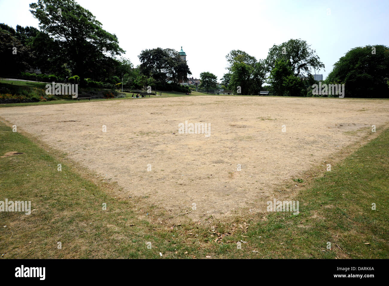 Parched grass on the old disused bowling green in Queens Park Brighton